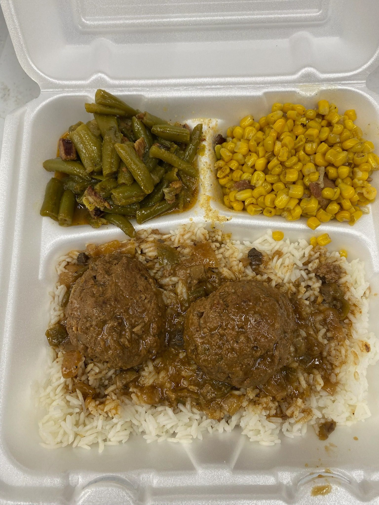 Rice, meatballs, green beans, and corn