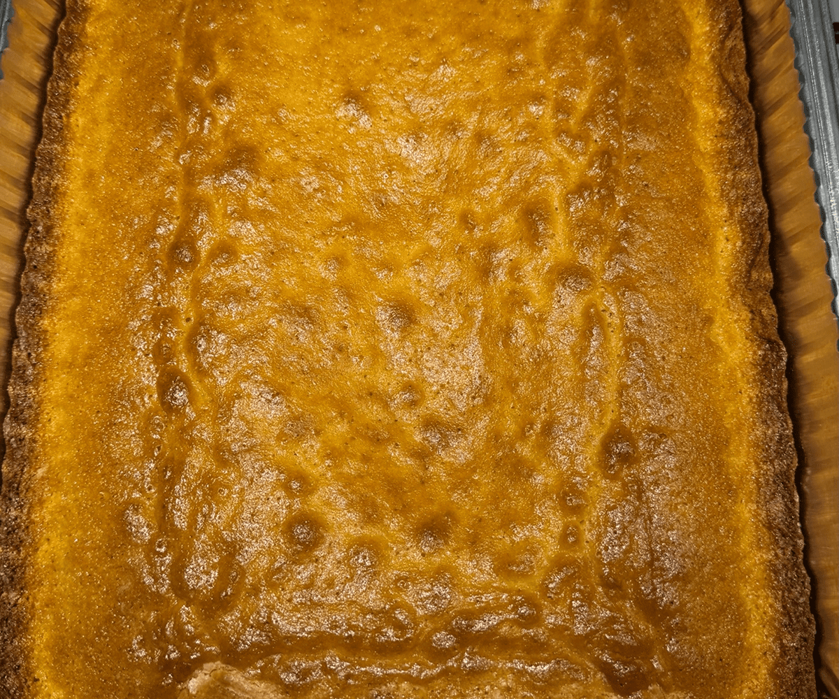 Freshly baked pumpkin pie surface